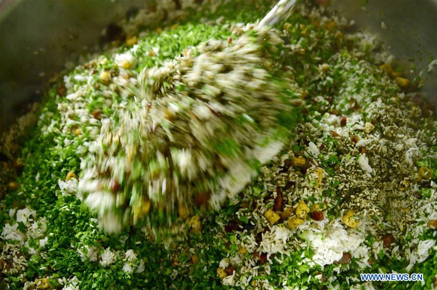 People of Tujia ethnic group make traditional food in Hubei